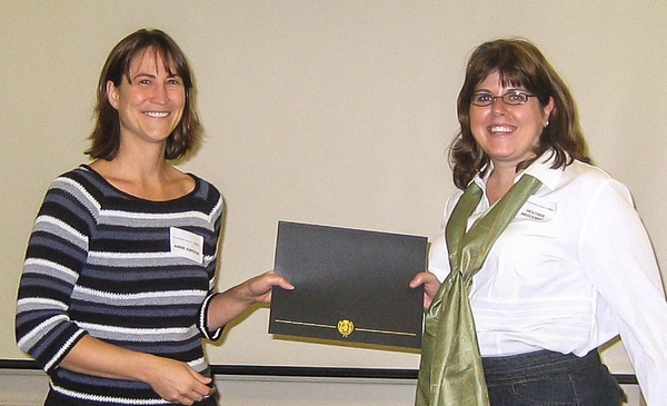 Heather receiving Poster Presentation Award at the Genetics Program Retreat